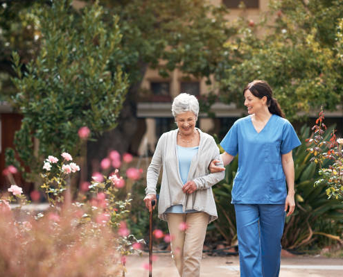 Caregiver and her patient out for a walk following a doctors' appointment