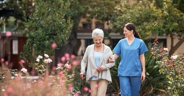 Caregiver and her patient out for a walk following a doctors' appointment
