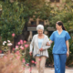 Caregiver and her patient out for a walk following a doctors' appointment